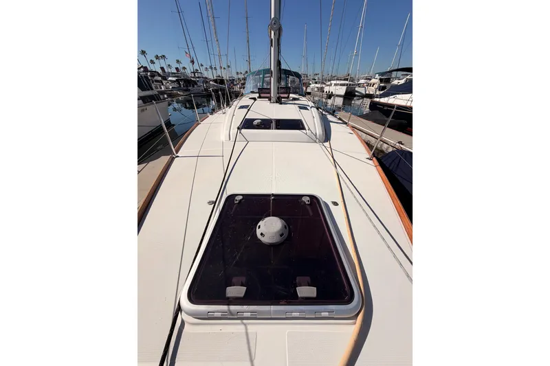 Slide: The Image of 2014 Jeanneau Sun Odyssey 469 sailboat deck view in marina setting. - 22