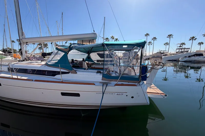 Slide: The Image of 2014 Jeanneau Sun Odyssey 469 sailboat docked in a sunny marina. - 4