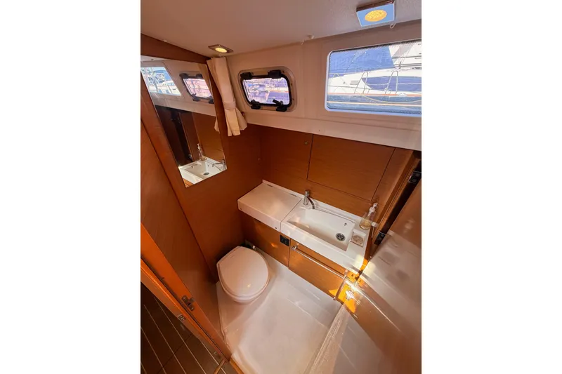 Slide: The Image of Bathroom interior of 2014 Jeanneau Sun Odyssey 469 yacht, featuring sink and toilet. - 59