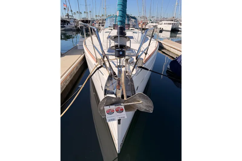Slide: The Image of 2014 Jeanneau Sun Odyssey 469 sailboat docked in marina, front view. - 6