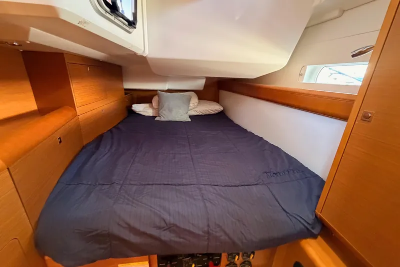 Slide: The Image of Cozy cabin interior of 2014 Jeanneau Sun Odyssey 469 sailboat with comfortable bedding. - 63