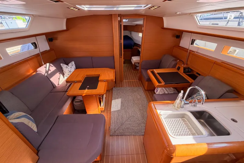 Slide: The Image of Luxurious interior of 2014 Jeanneau Sun Odyssey 469 yacht with modern furnishings and kitchen. - 66