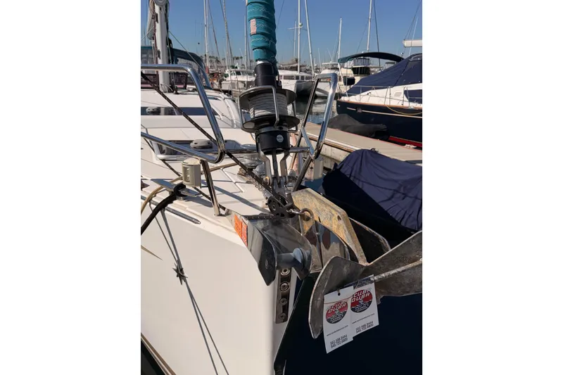 Slide: The Image of 2014 Jeanneau Sun Odyssey 469 sailboat bow with anchor at marina. - 7
