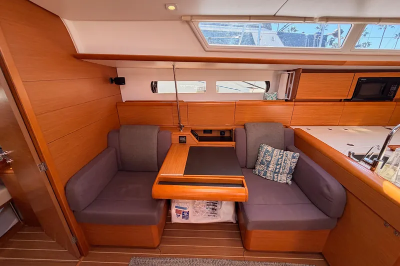 Slide: The Image of 2014 Jeanneau Sun Odyssey 469 interior with cozy seating and modern kitchen area. - 72