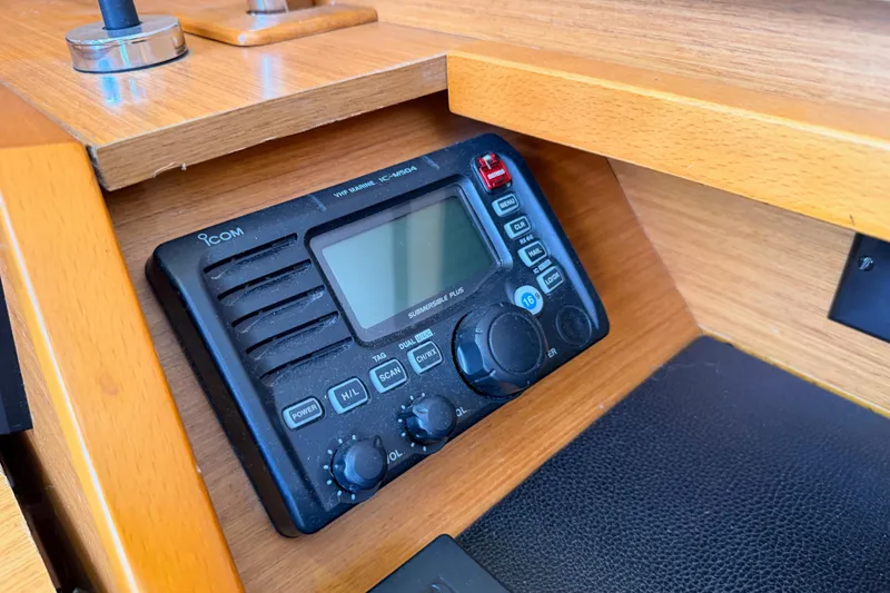Slide: The Image of VHF marine radio on 2014 Jeanneau Sun Odyssey 469 yacht's wooden interior. - 75