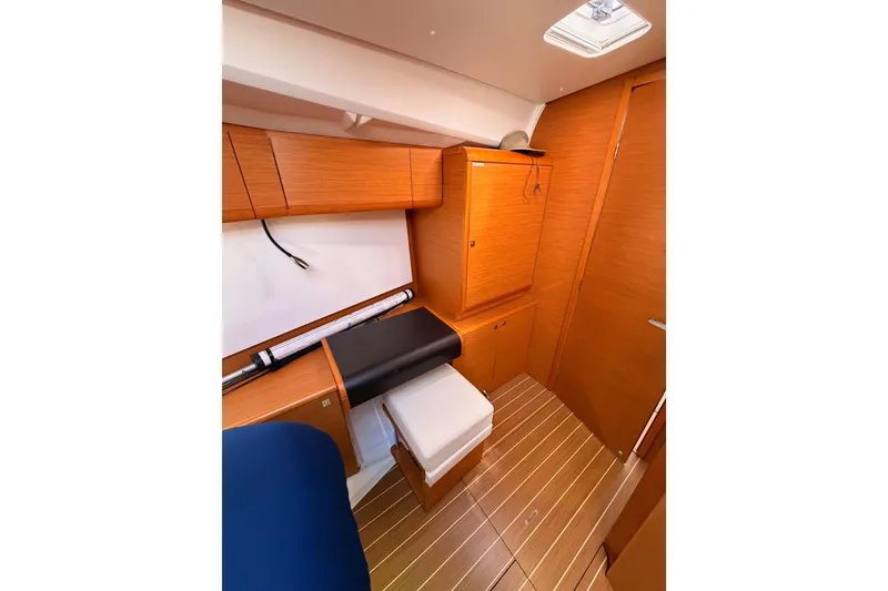 Slide: The Image of 2014 Jeanneau Sun Odyssey 469 cabin interior with wooden cabinetry and flooring. - 93