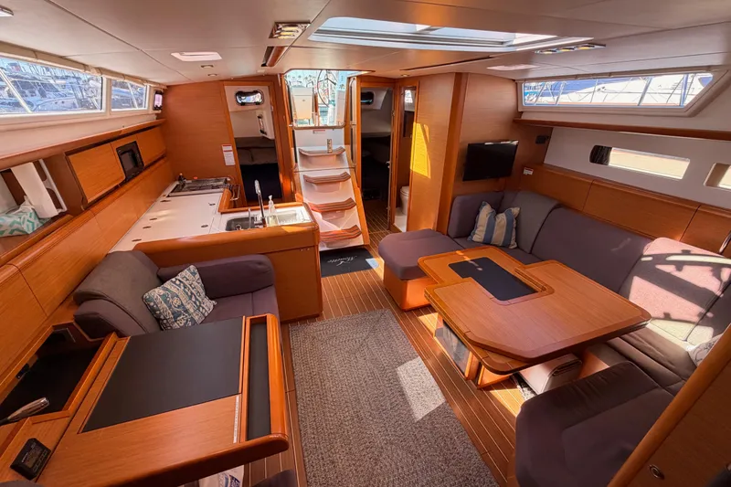 Slide: The Image of Luxurious interior of 2014 Jeanneau Sun Odyssey 469 yacht with modern furnishings and ample natural light. - 94