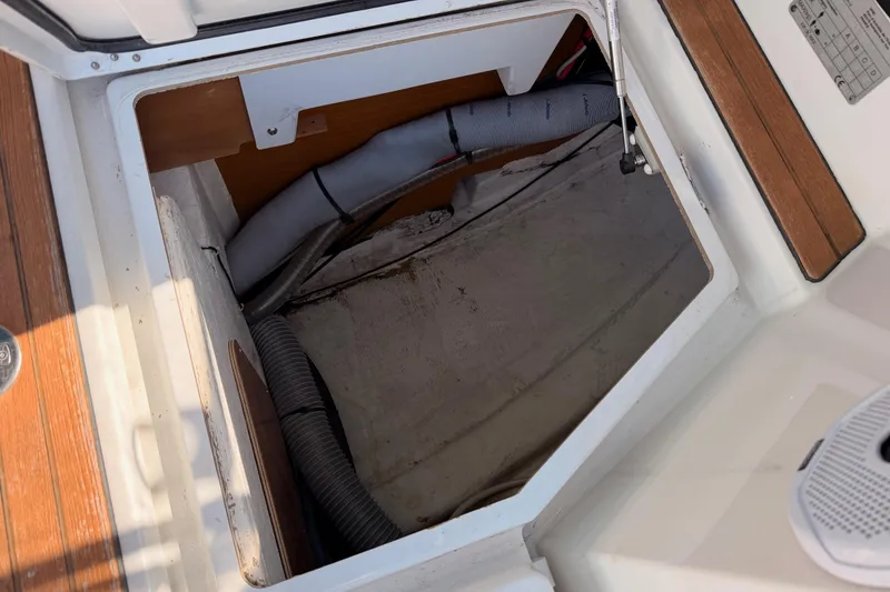 Slide: The Image of Open storage compartment on 2014 Jeanneau Sun Odyssey 469 sailboat deck. - 98