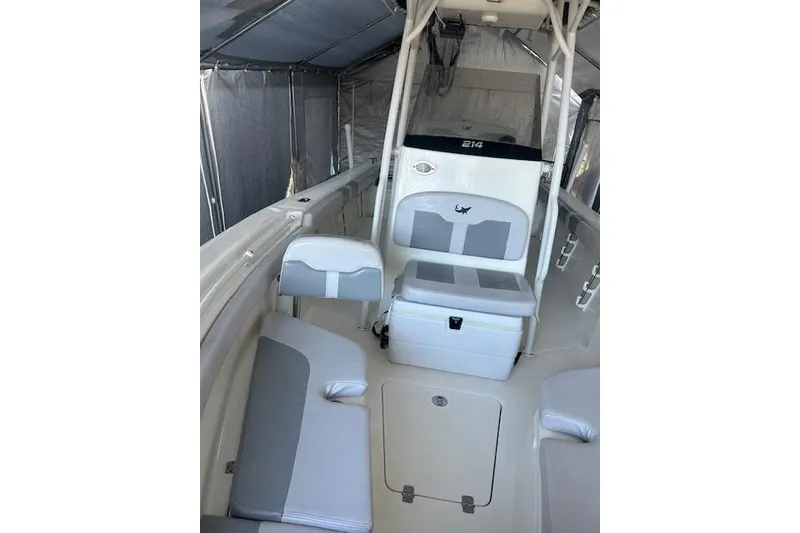 Slide: The Image of 2023 Mako 214 Center Console boat interior with seating and storage. - 3