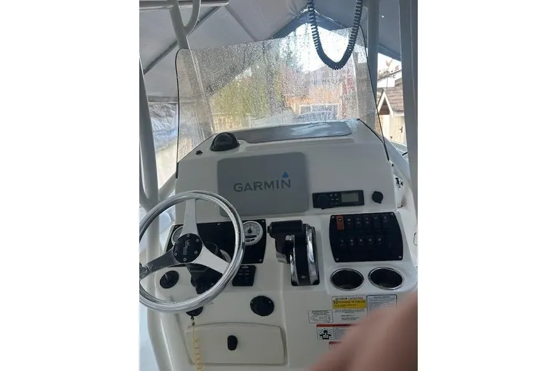Slide: The Image of 2023 Mako 214 Center Console boat dashboard with Garmin navigation system. - 7