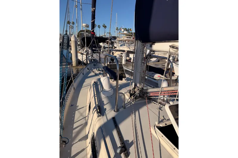 Slide: The Image of Sailboat deck view of 1995 Pacific Seacraft 34 in marina setting. - 17