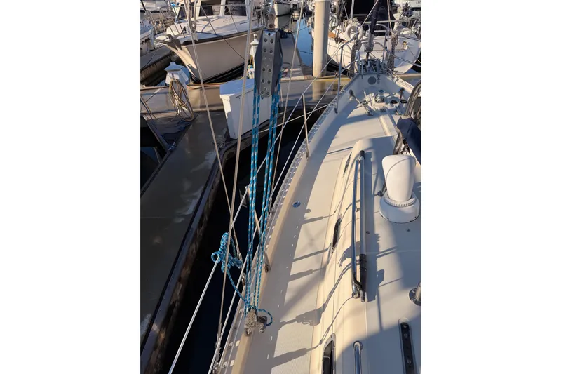 Slide: The Image of 1995 Pacific Seacraft 34 sailboat deck with rigging and marina view. - 18