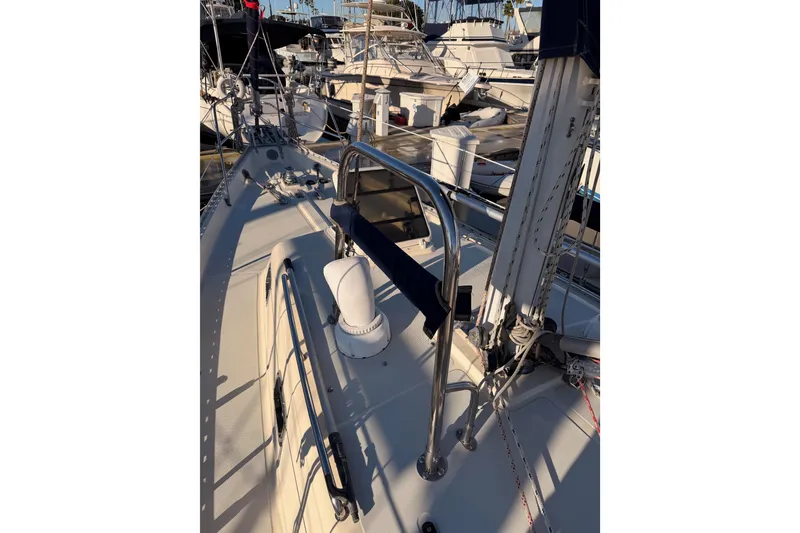 Slide: The Image of Sailboat deck view of 1995 Pacific Seacraft 34, docked in a marina. - 19