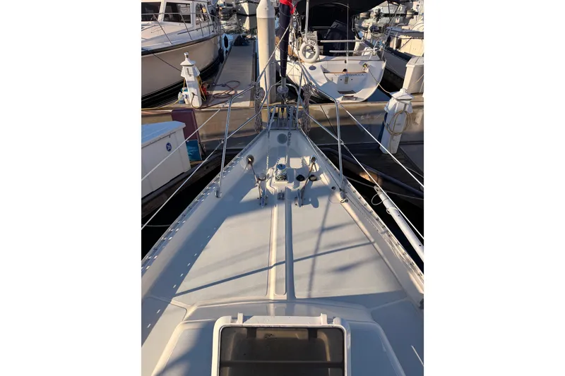 Slide: The Image of Sailboat deck view of 1995 Pacific Seacraft 34, docked in marina. - 20