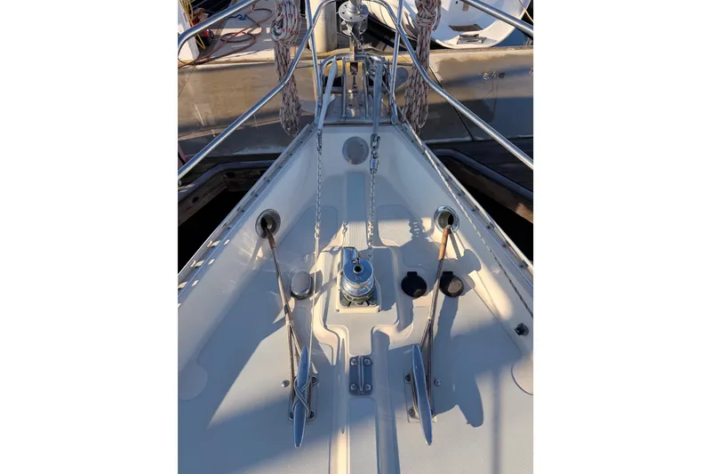 Slide: The Image of Bow of 1995 Pacific Seacraft 34 sailboat with anchor chain and deck fittings. - 21