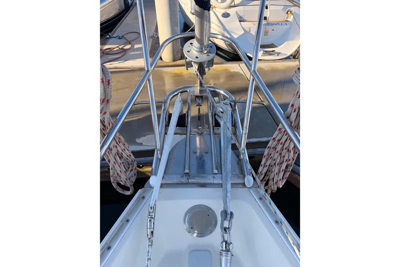 Slide: The Image of Bow of 1995 Pacific Seacraft 34 sailboat with anchor and ropes in marina. - 22