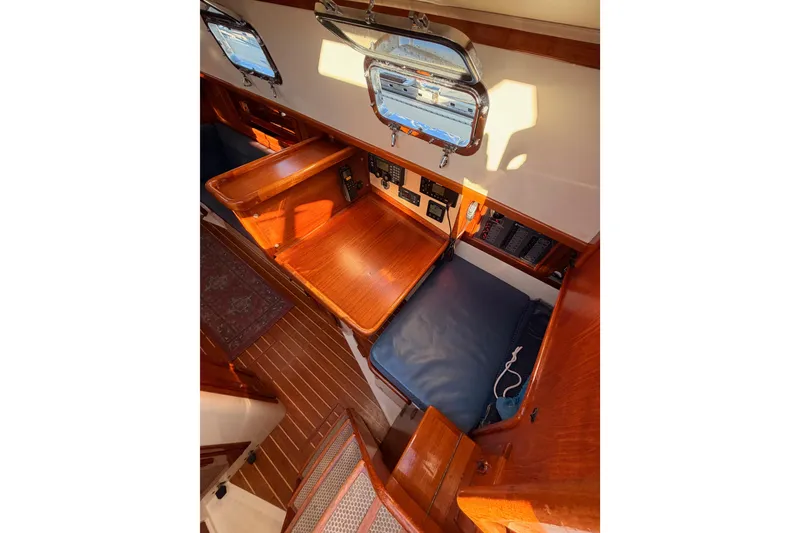 Slide: The Image of Interior of 1995 Pacific Seacraft 34 sailboat with wooden finish and navigation station. - 40
