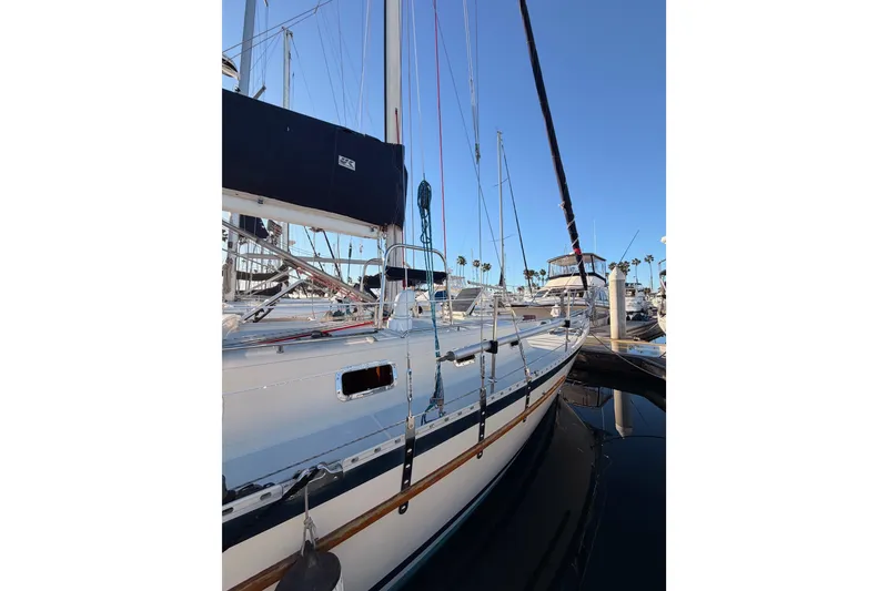 Slide: The Image of Sailboat docked at marina, Pacific Seacraft 34, 1995 model, clear blue sky. - 5