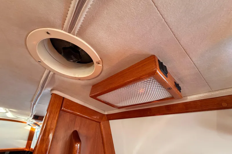 Slide: The Image of Ceiling light and vent in 1995 Pacific Seacraft 34 sailboat interior. - 59