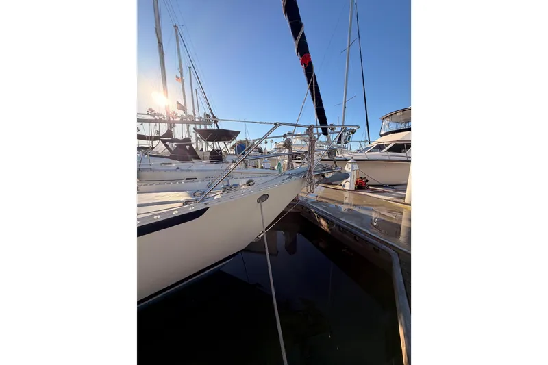 Slide: The Image of Sailboat docked at marina, Pacific Seacraft 34, 1995 model, under clear blue sky. - 6