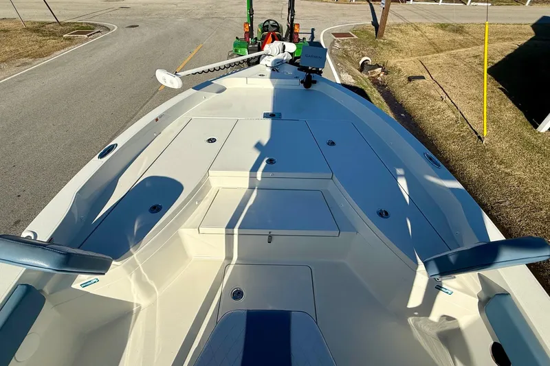 Slide: The Image of 2022 Ranger 2510 Bay boat deck with seating and storage compartments. - 15