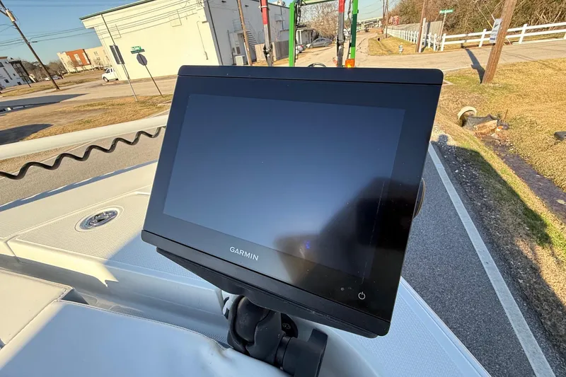 Slide: The Image of Garmin display on 2022 Ranger 2510 Bay boat, parked on a sunny street. - 19