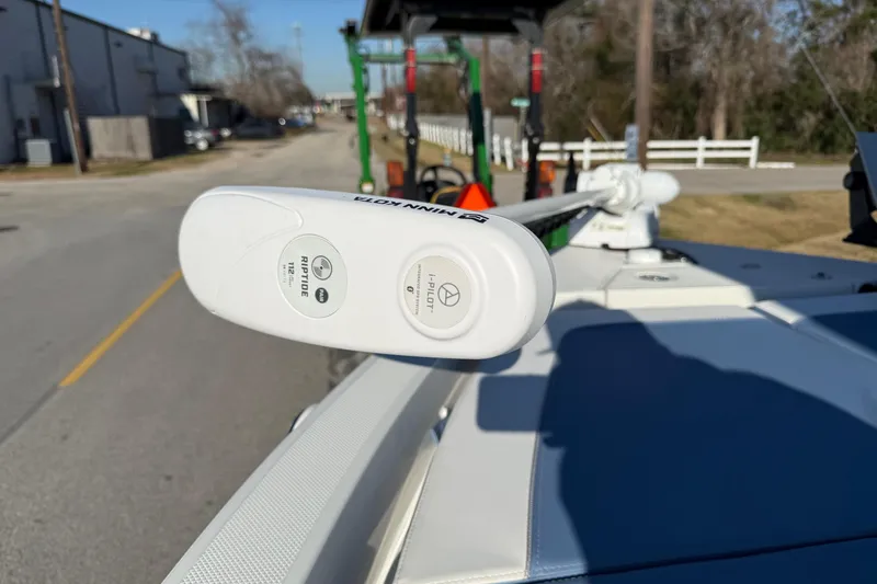 Slide: The Image of Minn Kota Riptide trolling motor on 2022 Ranger 2510 Bay boat, street background. - 20