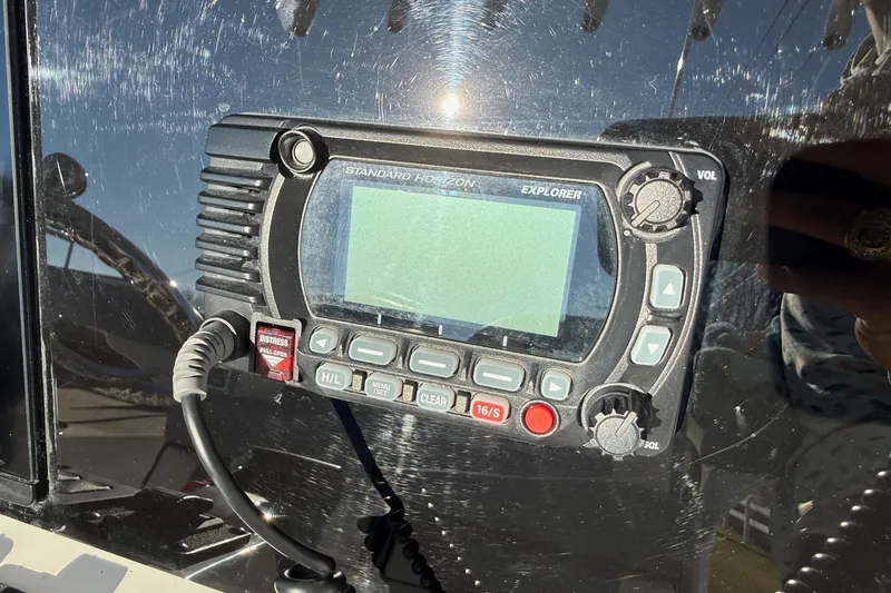 Slide: The Image of Standard Horizon Explorer radio on 2022 Ranger 2510 Bay boat dashboard. - 22