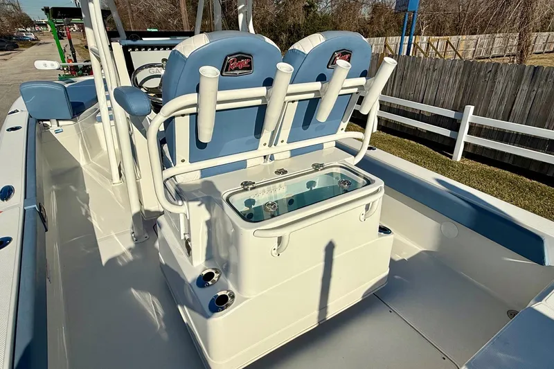 Slide: The Image of 2022 Ranger 2510 Bay boat interior with seating and rod holders. - 9