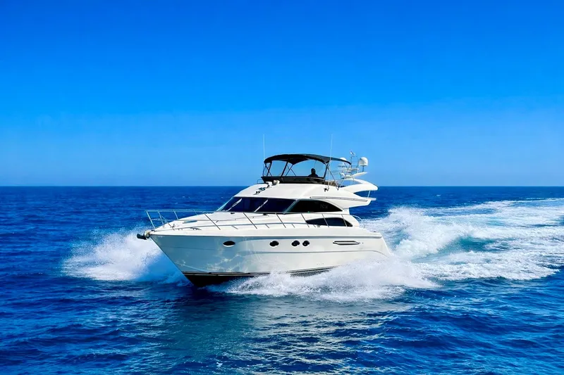 Slide: The Image of 2007 Viking Sport Cruisers 50 yacht cruising on open blue sea. - 0