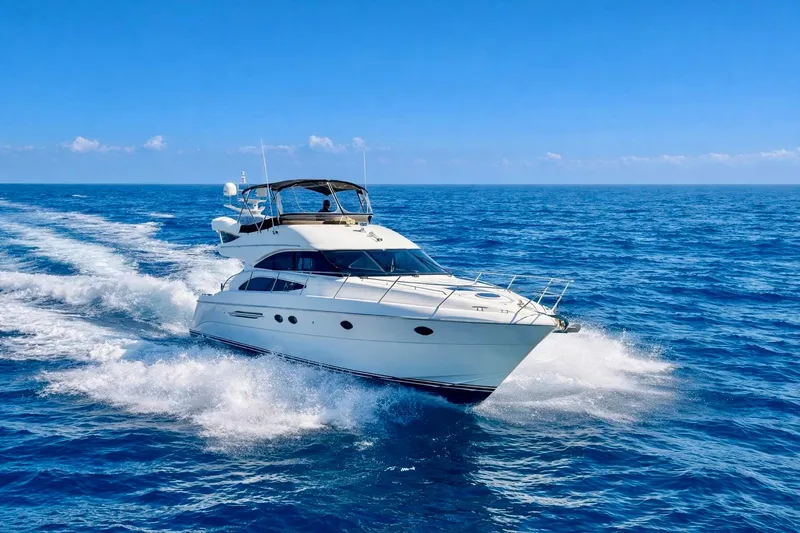 Slide: The Image of 2007 Viking Sport Cruisers 50 yacht cruising on open blue sea. - 1
