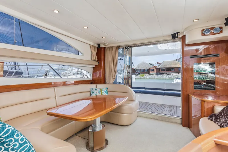 Slide: The Image of Luxurious interior of a 2007 Viking Sport Cruiser yacht with elegant seating and wooden accents. - 15