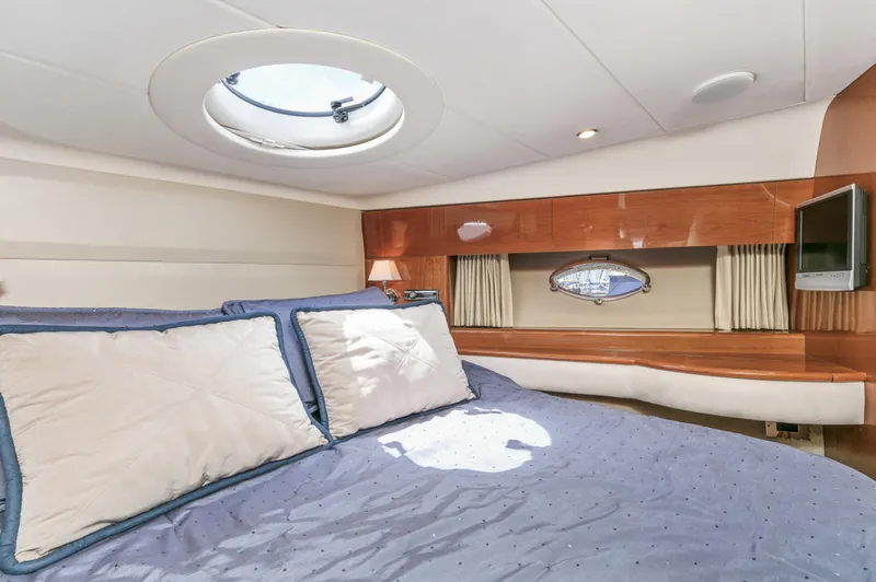 Slide: The Image of Luxurious cabin interior of a 2007 Viking Sport Cruiser yacht with cozy bedding. - 28