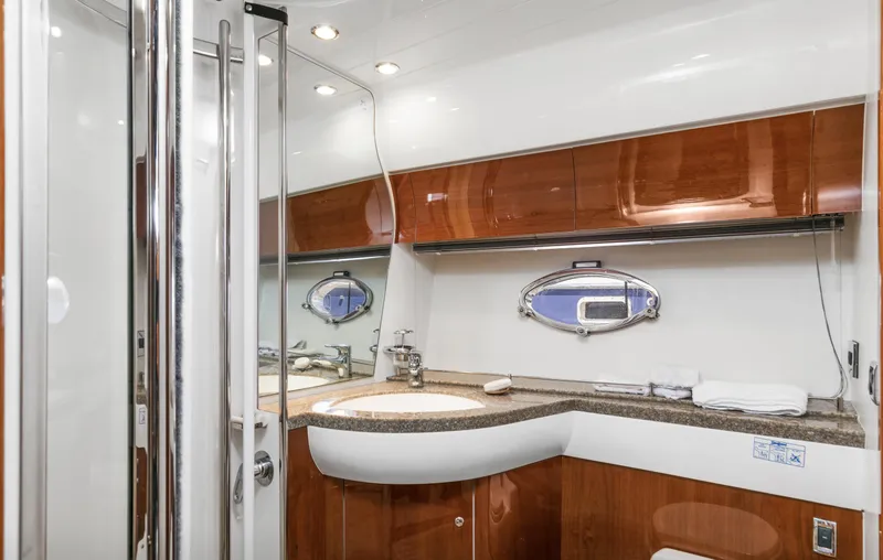 Slide: The Image of Luxurious bathroom interior of 2007 Viking Sport Cruiser with wood accents and modern fixtures. - 29