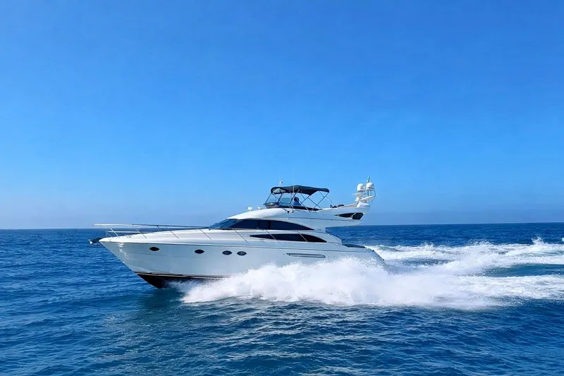Slide: The Image of 2007 Viking Sport Cruisers 50 yacht cruising on open blue sea. - 3
