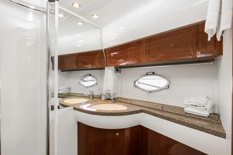 Slide: The Image of Luxurious bathroom in 2007 Viking Sport Cruiser with elegant wood and modern fixtures. - 32