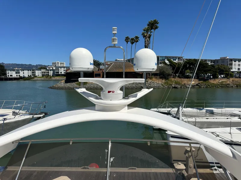 Slide: The Image of 2007 Viking Sport Cruiser yacht docked in a marina with clear blue sky. - 37
