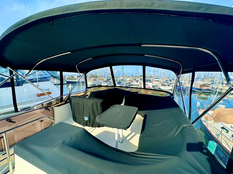 Slide: The Image of 2007 Viking Sport Cruiser with covered deck, docked at marina. - 44
