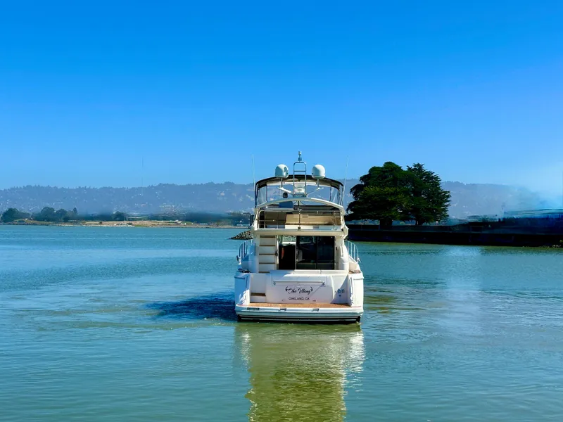 Slide: The Image of 2007 Viking Sport Cruiser on calm water under clear blue sky. - 7