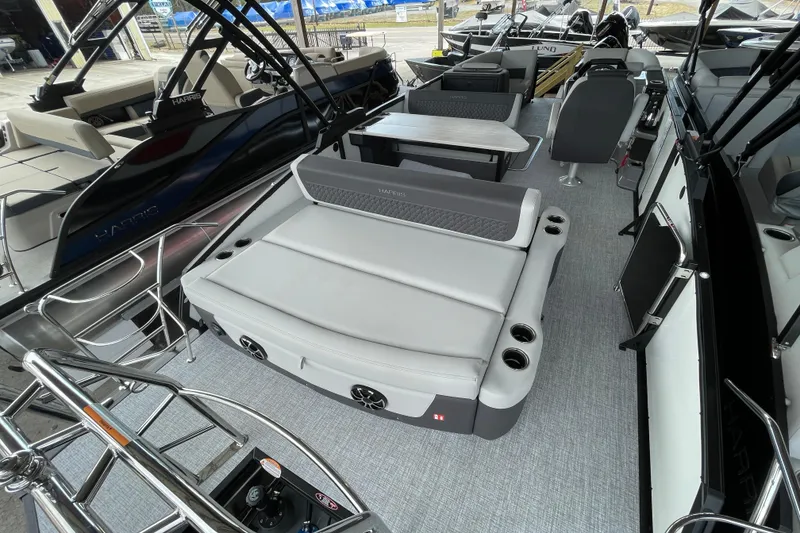 Slide: The Image of 2026 Harris Sunliner 230 pontoon boat interior with gray seating and modern design. - 15