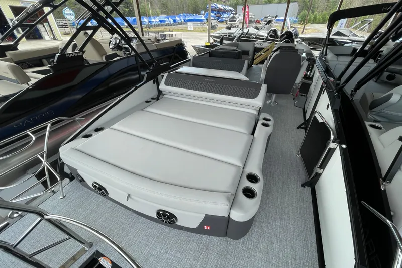 Slide: The Image of 2026 Harris Sunliner 230 boat interior with spacious seating and modern design. - 16