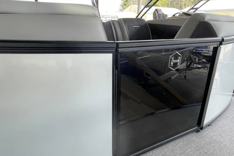 Slide: The Image of 2026 Harris Sunliner 230 boat interior with sleek seating and modern design. - 5