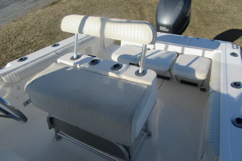 Slide: The Image of 2000 Sport-Craft 24 CC boat interior with cushioned seating and Yamaha 250 engine. - 16