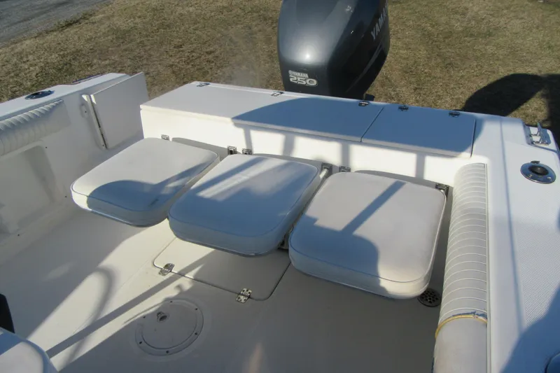 Slide: The Image of 2000 Sport-Craft 24 CC boat interior with cushioned seating and Yamaha 250 outboard motor. - 17