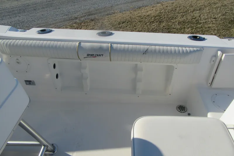 Slide: The Image of Sport-Craft 24 CC boat interior, 2000 model, featuring seating and rod holders. - 20