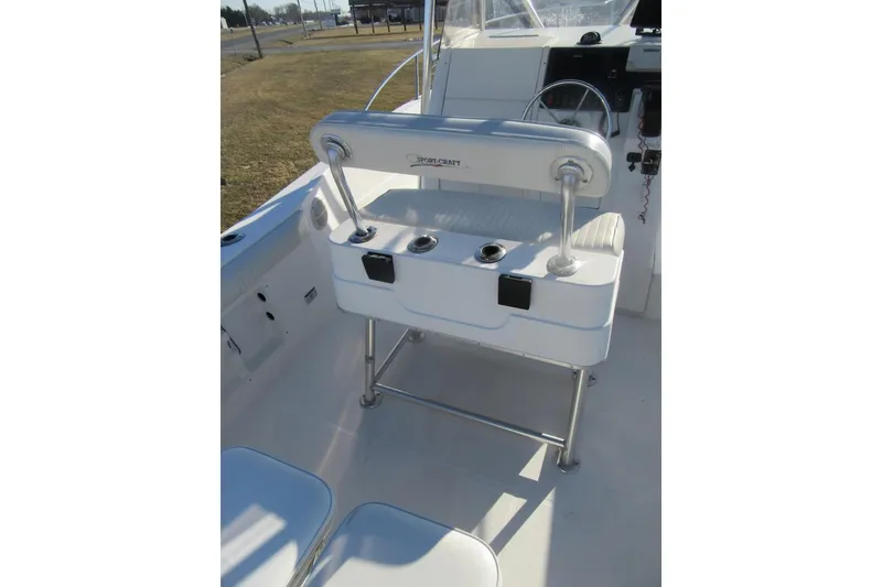 Slide: The Image of 2000 Sport-Craft 24 CC boat interior with seating and steering console. - 22