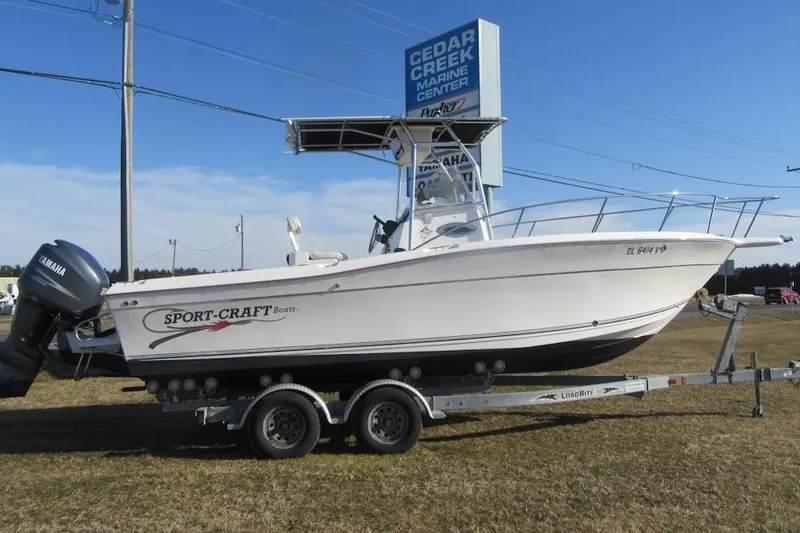 Slide: The Image of 2000 Sport-Craft 24 CC boat on trailer at Cedar Creek Marine Center. - 3
