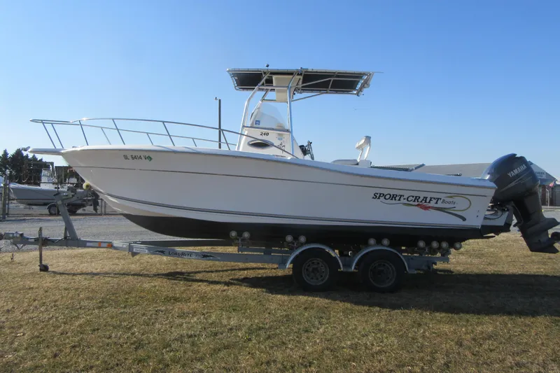 Slide: The Image of 2000 Sport-Craft 24 CC boat on trailer, side view, outdoors. - 5