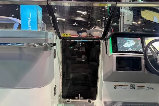 Slide: The Image of 2026 Regal LS6 Surf boat interior with modern dashboard and controls. - 12