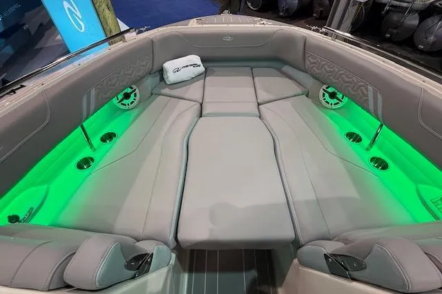 Slide: The Image of 2026 Regal LS6 Surf boat interior with green LED lighting and luxurious seating. - 24